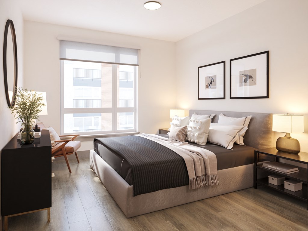a bedroom with a large bed and a window at Bemiston Place Apartments, Missouri, 63105