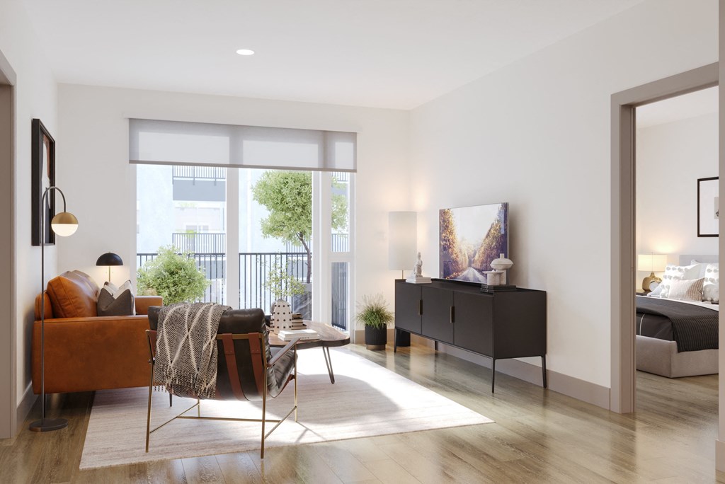 a living room with a couch and a table and a tv at Bemiston Place Apartments, Clayton, MO 63105