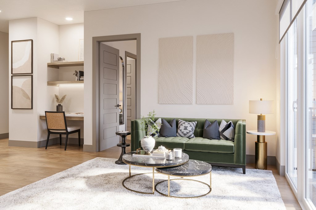 a living room with a green couch and a coffee table at Bemiston Place Apartments, Clayton