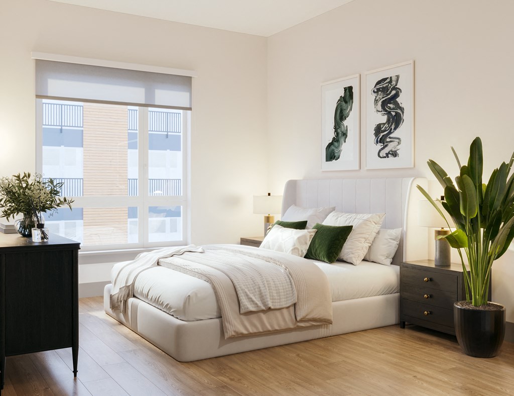a bedroom with a white bed and a large window at Bemiston Place Apartments, Clayton, MO