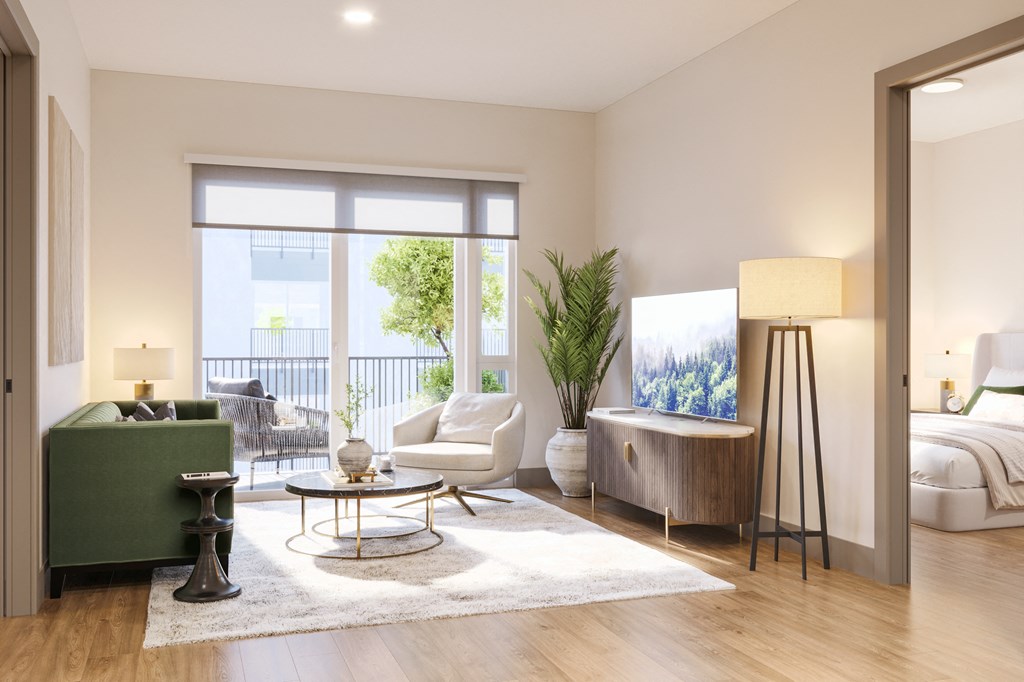 a living room with a couch and a chair and a tv at Bemiston Place Apartments, Clayton, MO 63105