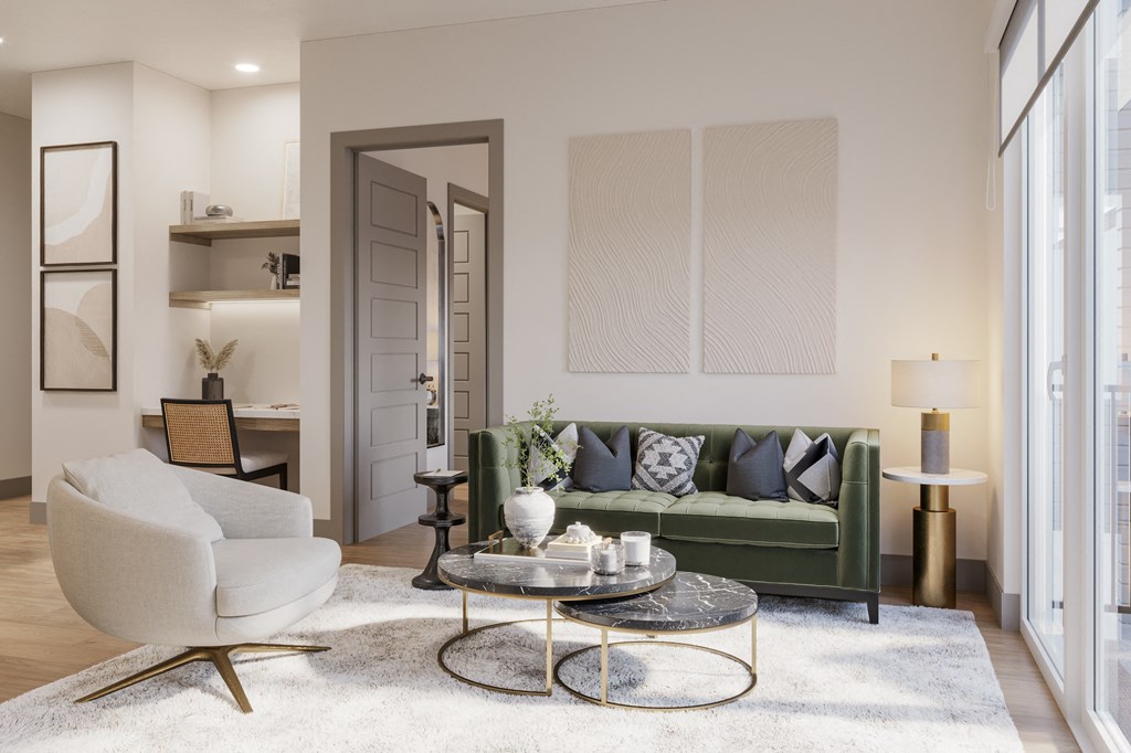 a living room with a green couch and a white rug at Bemiston Place Apartments, Clayton, 63105