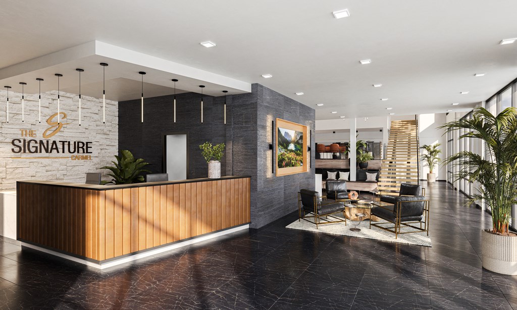 a lobby with a reception desk and a seating area