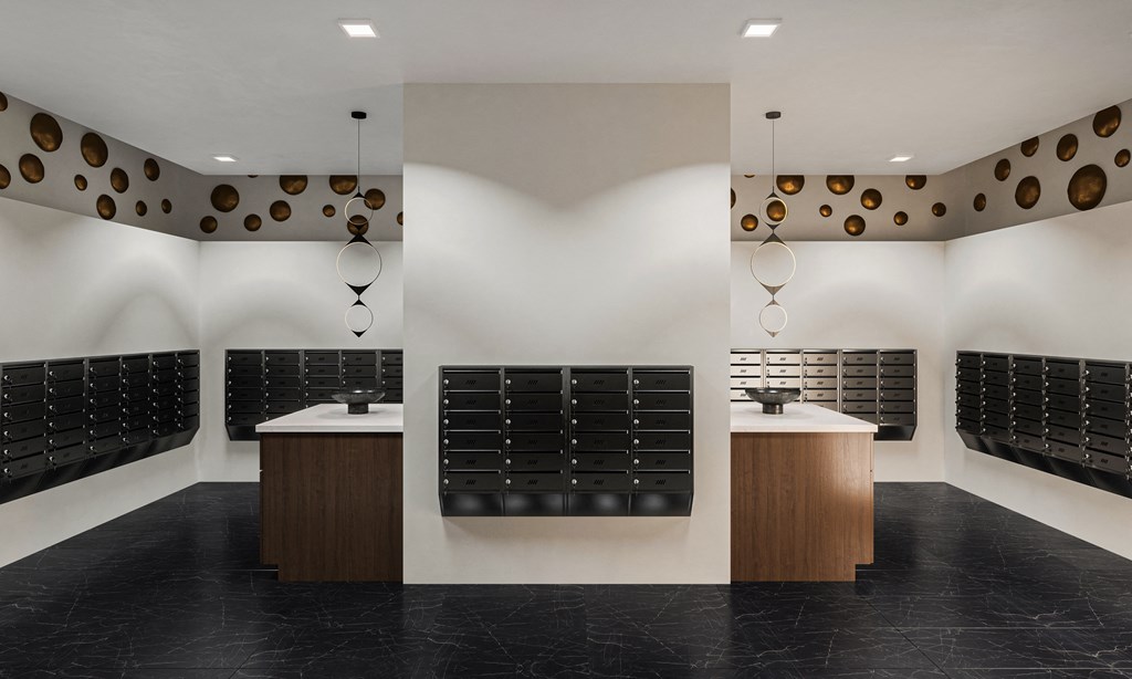 a tasting room with white walls and black flooring and a row of wine racks