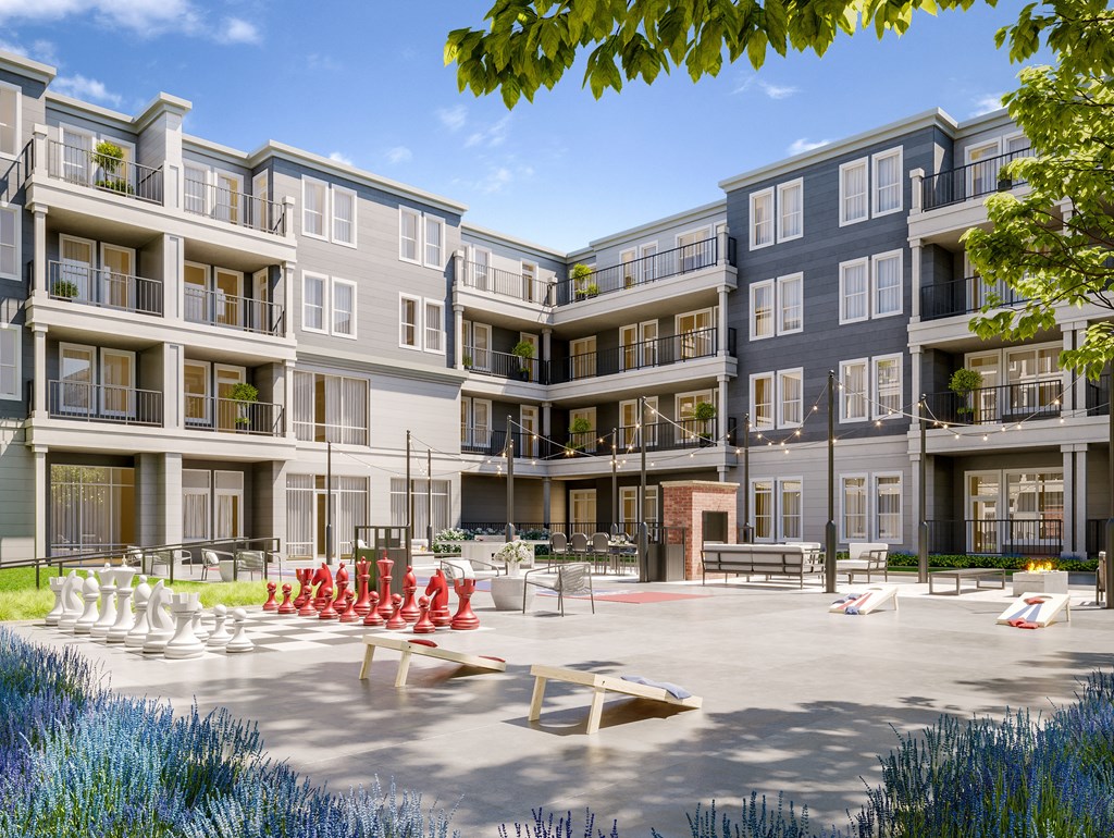 a rendering of an apartment building with a patio and fire pit