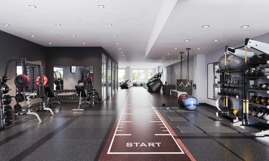 a workout room with treadmills and other workout equipment in a modern home gym