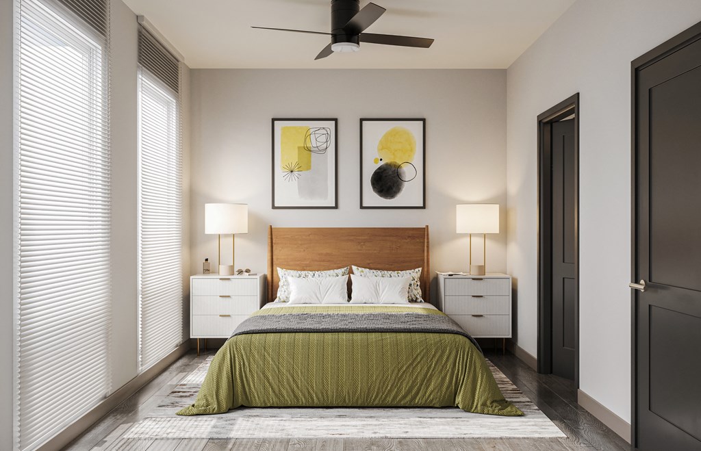 a bedroom with a bed and a ceiling fan
