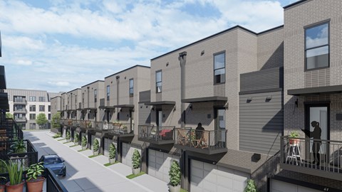 back of the building with garage access at The Flats & Terraces at Wildhorse Village, Chesterfield, 63005