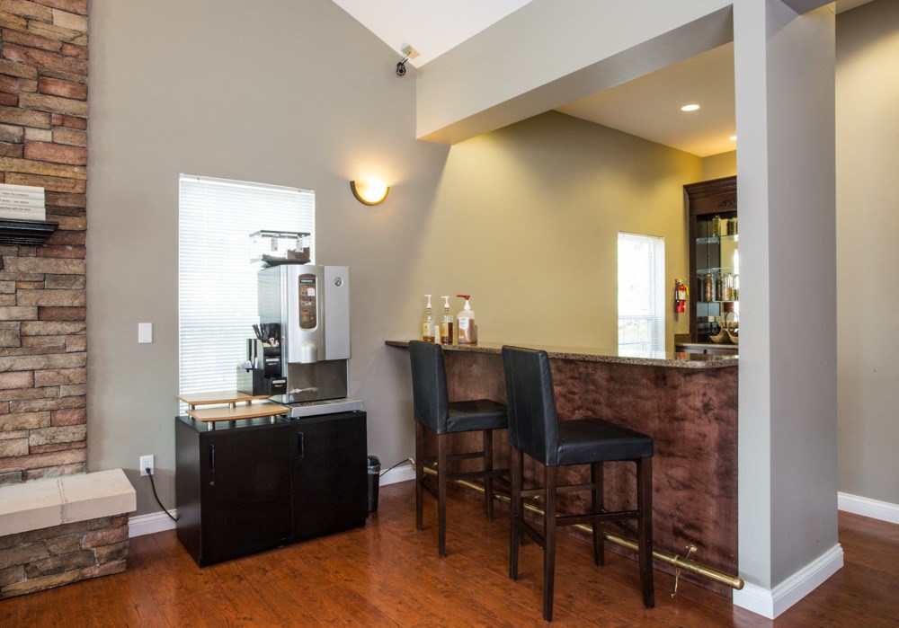 bar with stools, and coffee machine at Villas At Crystal Lake, Swansea, 62226