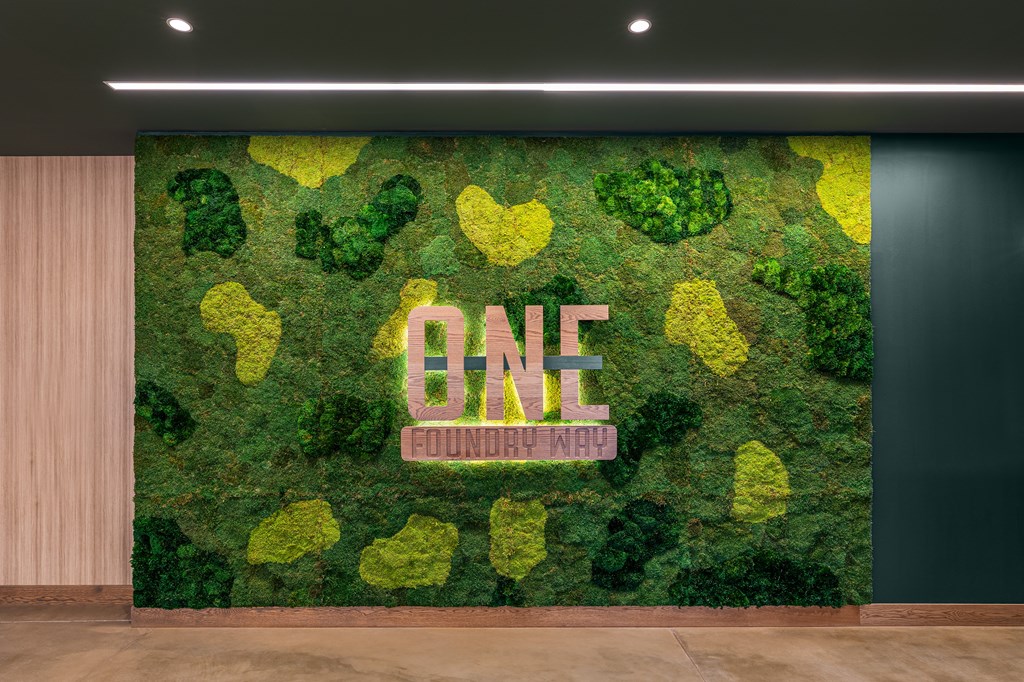 A green wall with the word ONE in the middle.