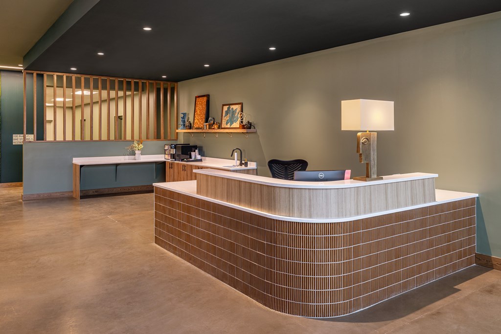 A reception area with a counter and a couch.