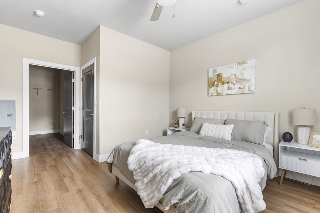 a bedroom with a bed and a closet at The Junction at Rogers, Rogers, 72756