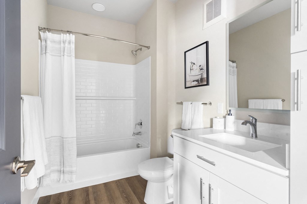 a bathroom with a sink and a toilet and a shower at The Junction at Rogers, Rogers, Arkansas