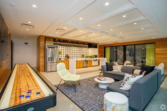 Clubroom View including common space kitchen area, seating area, and shuffleboard table