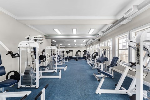 Gym with cardio equipment and a large window at Timber Lakes at Red Bridge, Missouri 