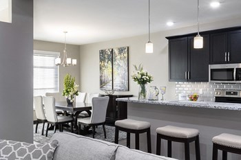 dining table surrounded by four chairs