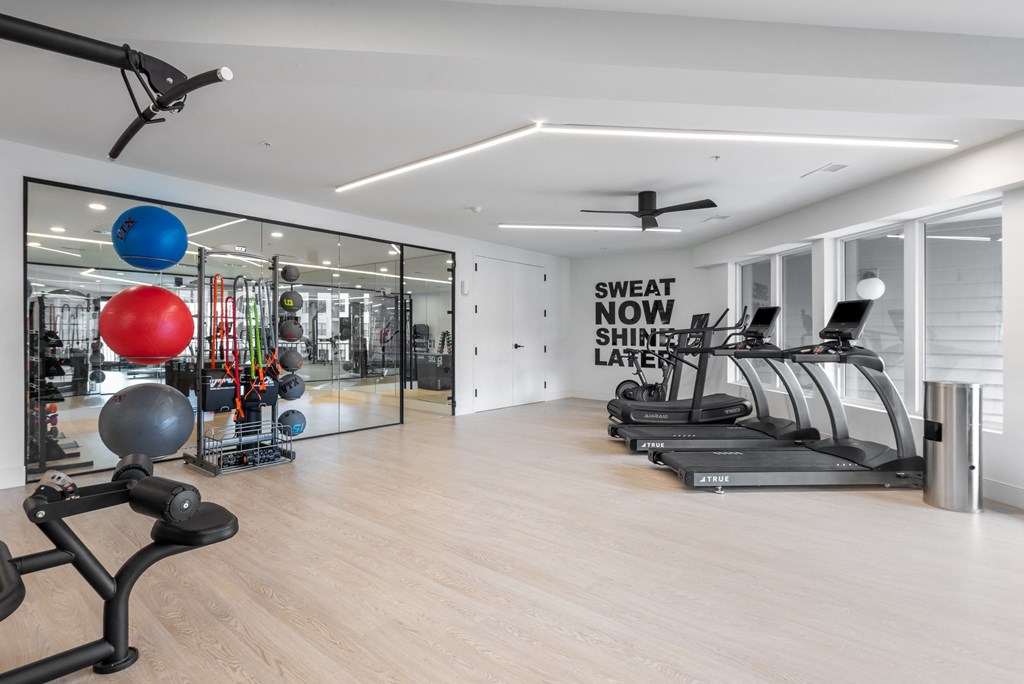 the gym is equipped with treadmills and other fitness equipment