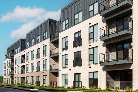 modern apartment buildings on a city street at The Flats & Terraces at Wildhorse Village, Missouri, 63005