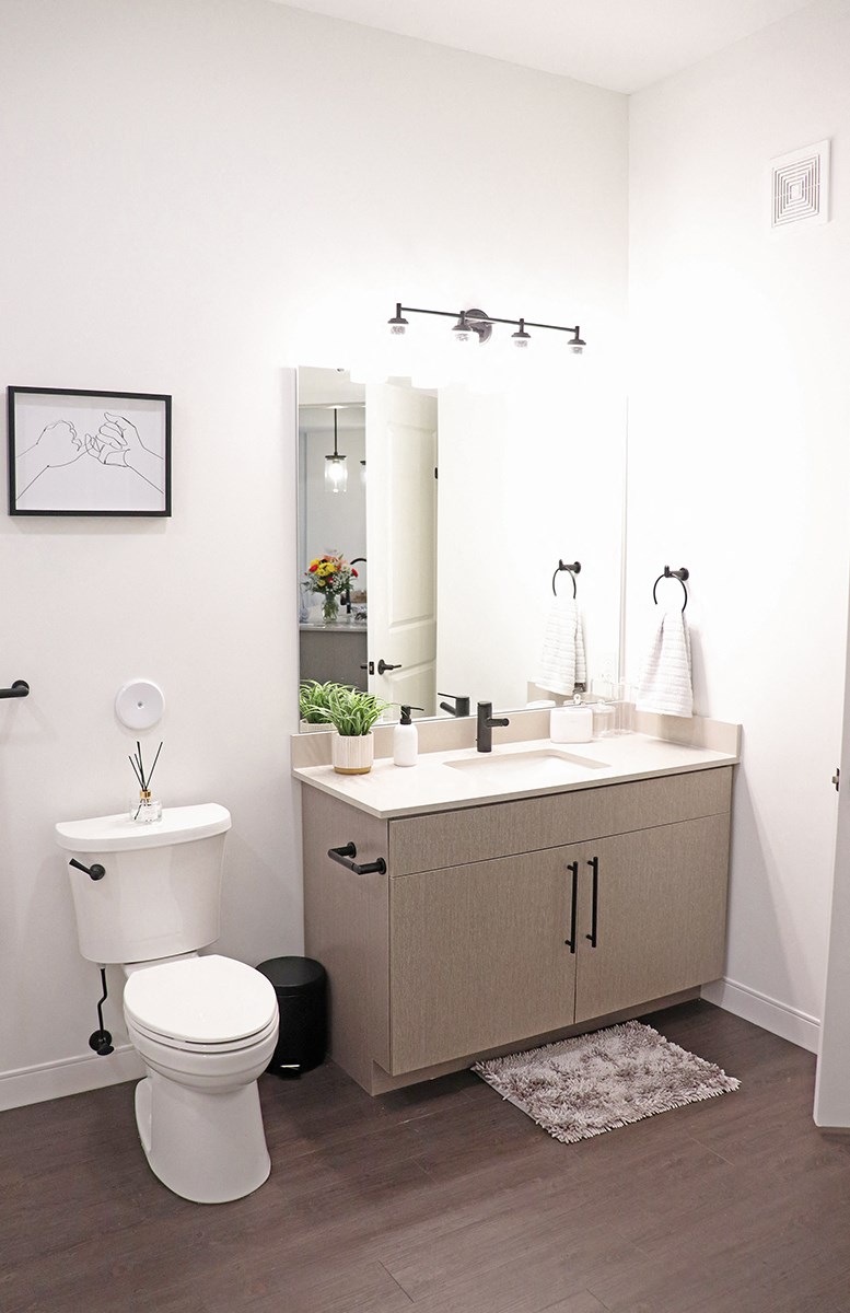 a small bathroom with a toilet sink and mirror