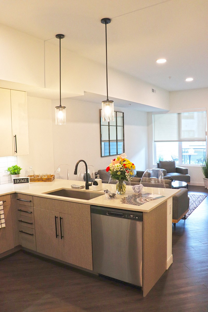 a view of the kitchen and living room of a new home