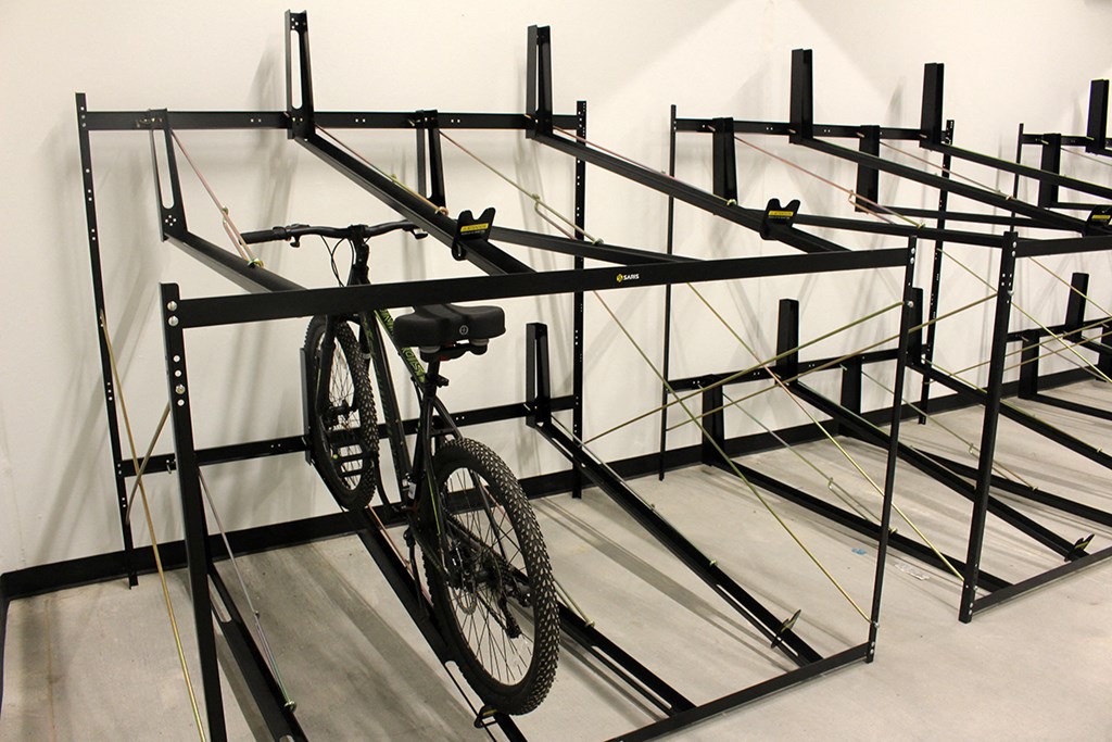 a bike rack with a bike on it in a room