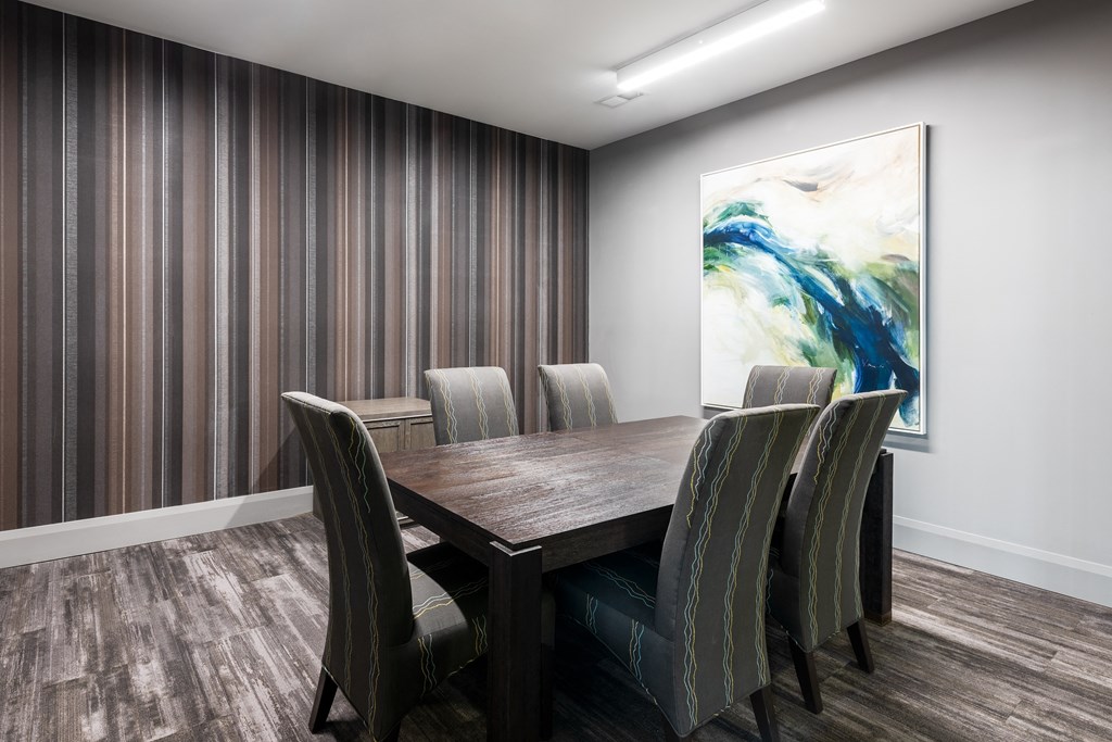 Hibernia shared conference room with conference table and 6 chairs at Hibernia Apartments, Missouri