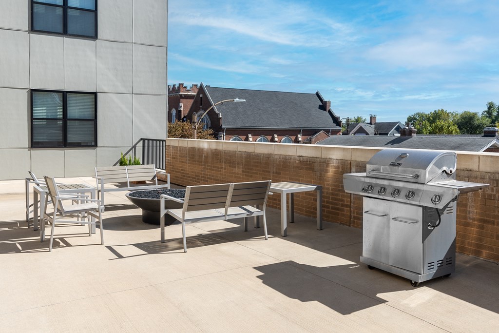 Hibernia resident amenity deck with grilling station and fire pit at Hibernia Apartments, St Louis, MO
