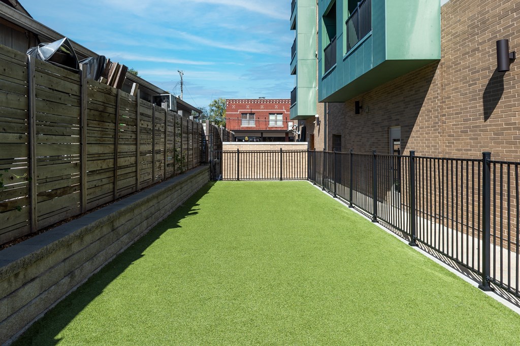 Hibernia fenced pet park with green turf at Hibernia Apartments, St Louis, Missouri