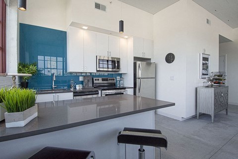 a kitchen with a counter top and a refrigerator