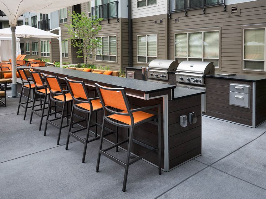Image of two gas grills and outdoor bar