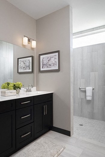 dark vanity with white top in bathroom - Photo Gallery 9