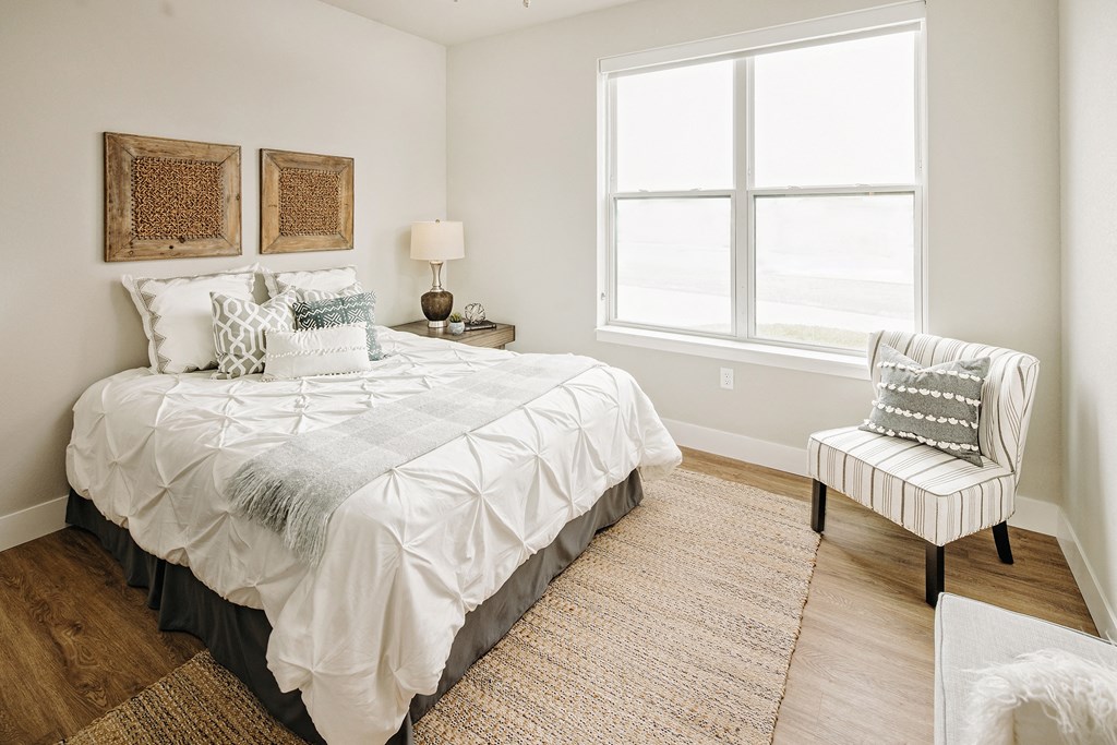 a bedroom with a bed and a window at 44 West Luxury Living, Valley Park, Missouri
