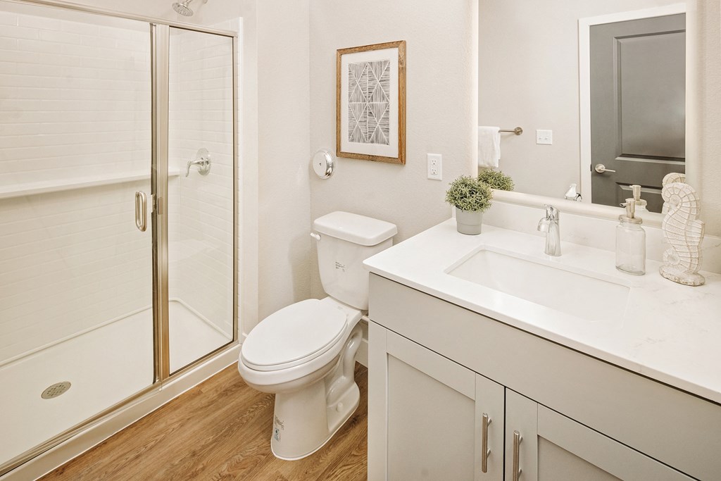 a bathroom with a toilet sink and shower at 44 West Luxury Living, Valley Park