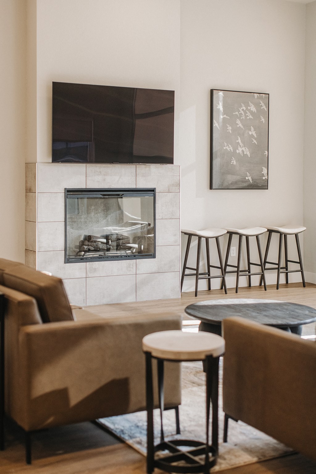 a living room with a fireplace and chairs and tables at 44 West Luxury Living, Valley Park, 63088