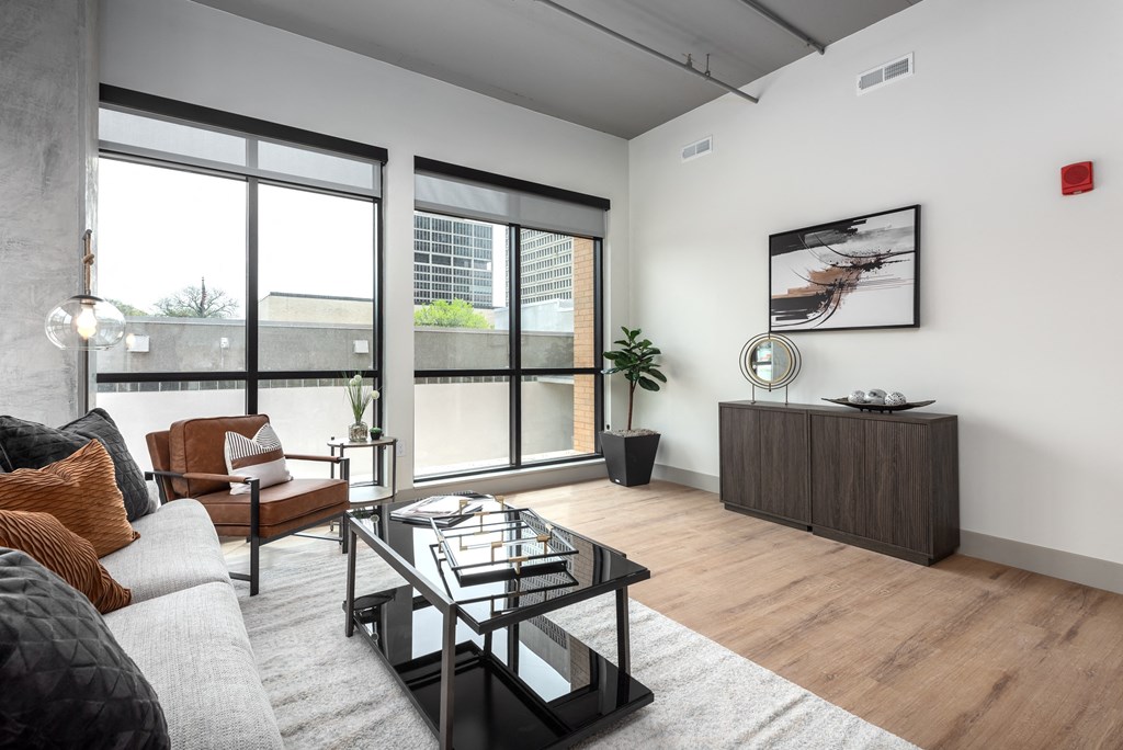 a living room with a couch and a coffee table at Bemiston Place Apartments, Clayton, MO