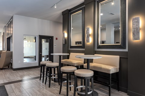 A modern bar area with a black and white color scheme.
