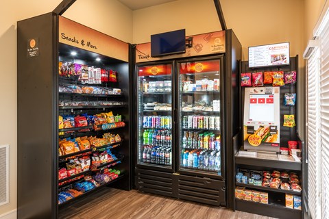 A snack and drink vending machine with a variety of items.