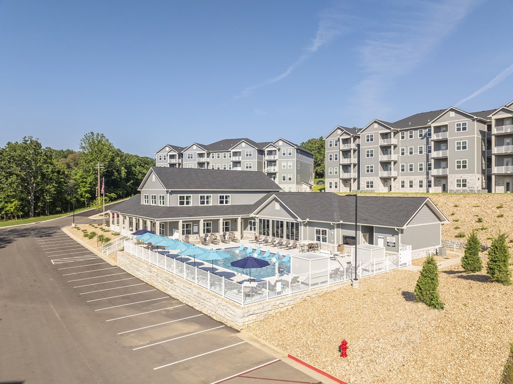 A large building with a pool in front of it.at Preserve at Sycamore Creek, Osage Beach, 65065