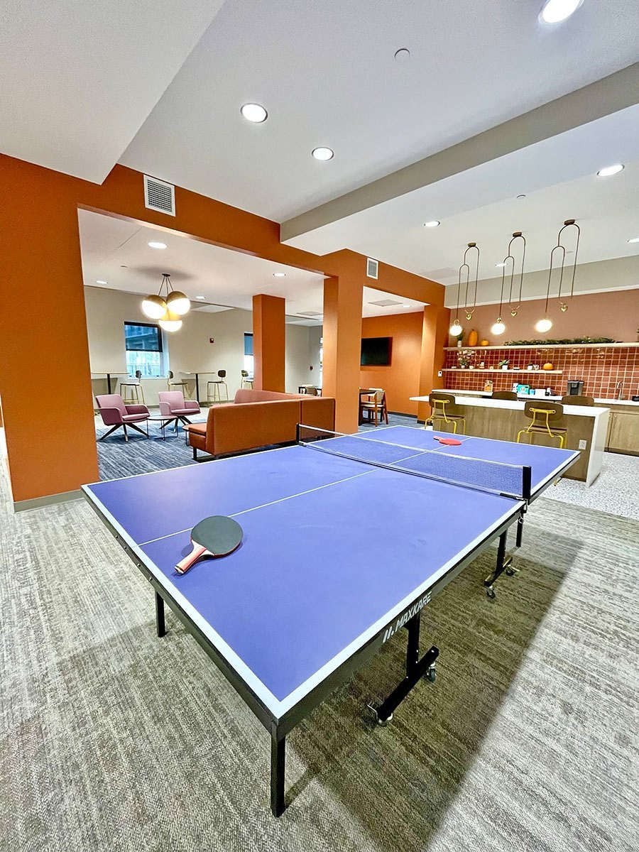 clubroom/resident lounge with ping pong table at The Residences at Delmar DivINe, St Louis, MO