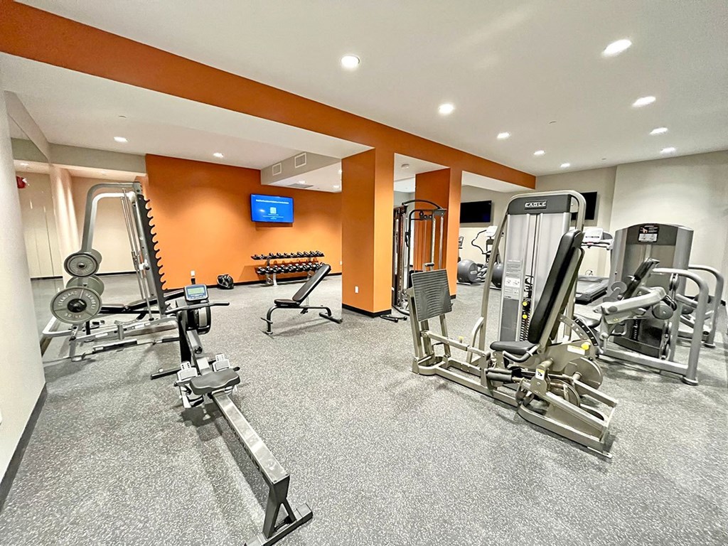 large fitness center with exercise equipment  at The Residences at Delmar DivINe, St Louis, MO, 63112