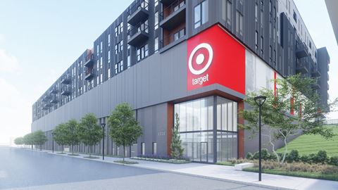 a rendering of the exterior of a building with a red target sign