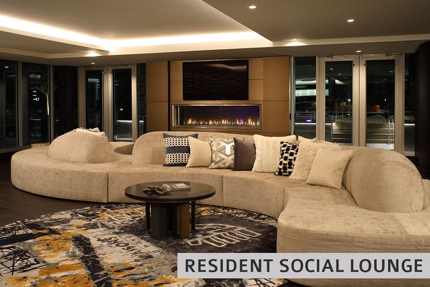 a living room with a large couch and a fireplace - Photo Gallery