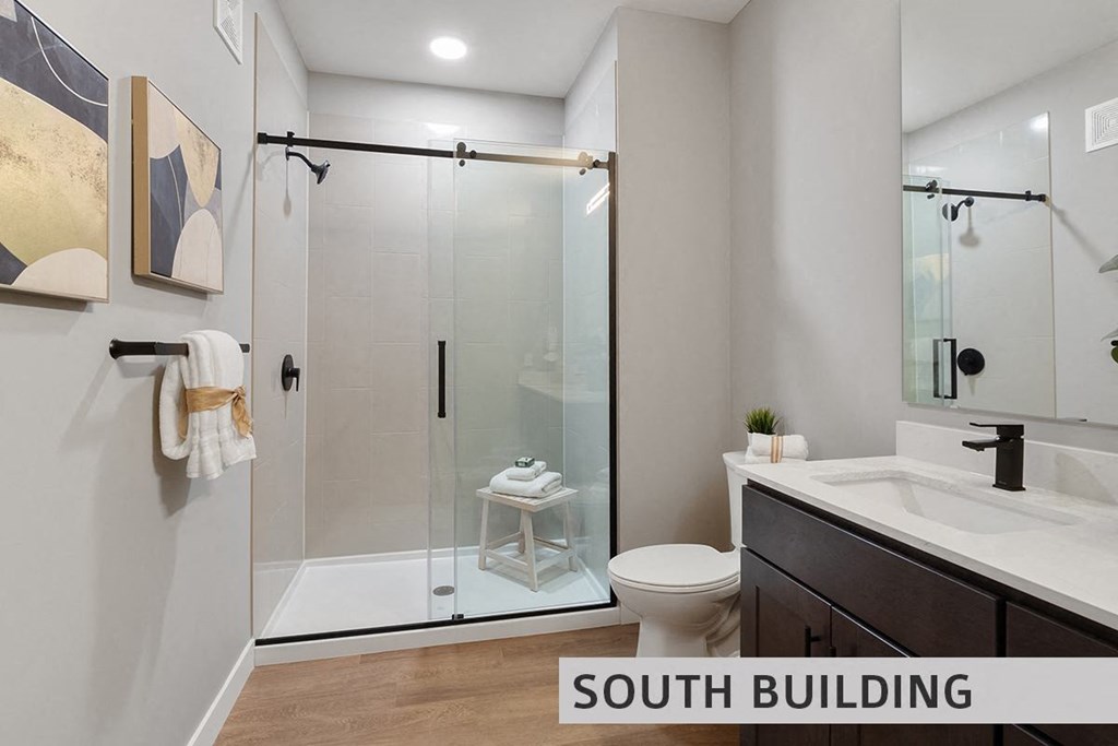 a bathroom with a toilet sink and shower  at Expo at Forest Park, St. Louis, MO