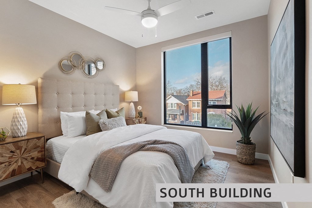 a bedroom with a large window  at Expo at Forest Park, St. Louis, 63112