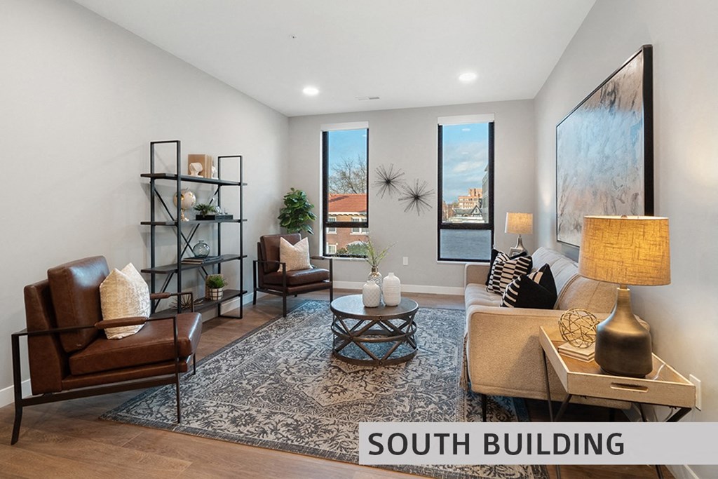 a living room with a couch chairs and a coffee table  at Expo at Forest Park, St. Louis, 63112