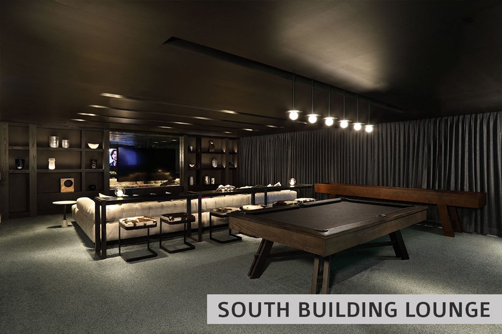 a dark room with a pool table and a tv in the background  at Expo at Forest Park, St. Louis, 63112