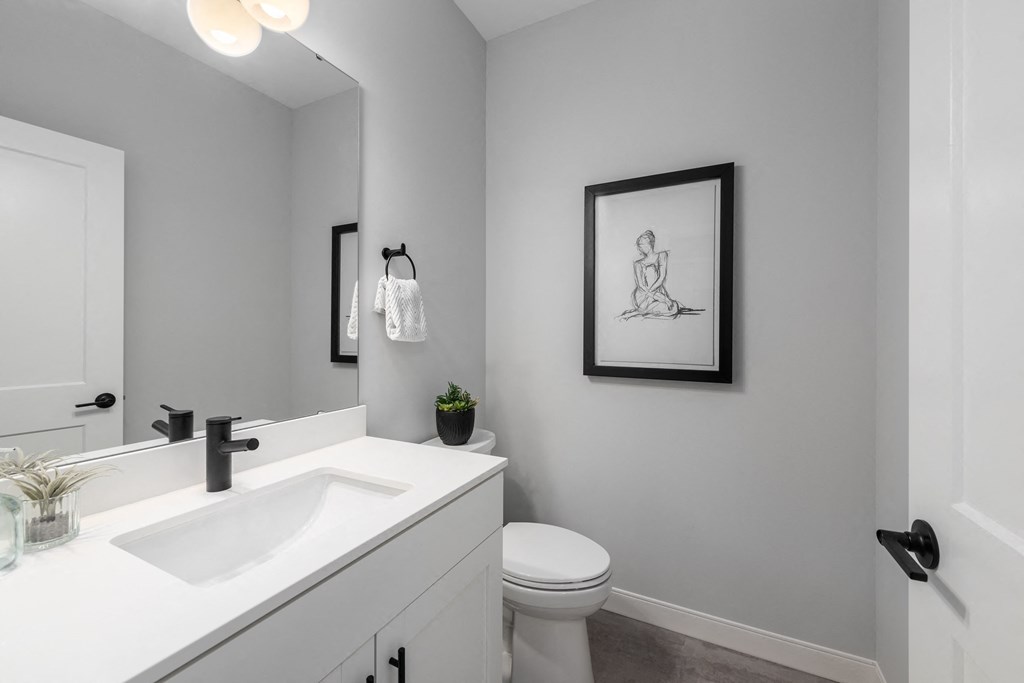 an empty bathroom with a sink and a toilet