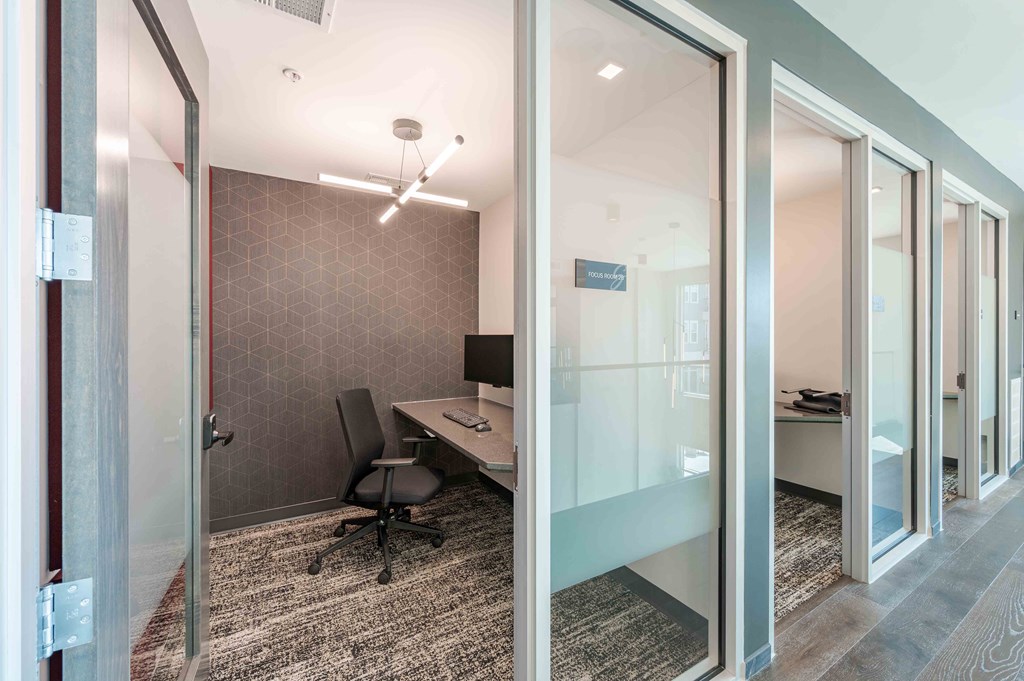 A room with a desk and a chair.