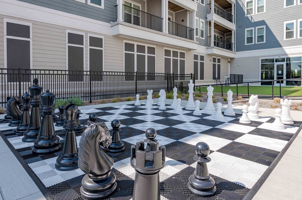 A giant chess board in front of a building.
