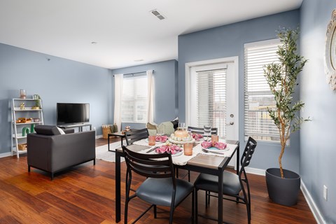 Open concept dining and living room area at The Landing Apartments, St. Louis